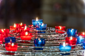 Burning candles in the Notre-Dame de Paris before the big fire, a medieval Catholic cathedral on...