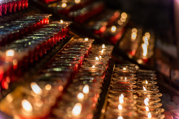 Burning candles in the Notre-Dame de Paris before the big fire, a medieval Catholic cathedral on...