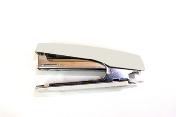 cream color stapler isolated on a white background.

