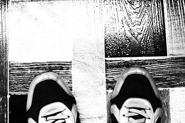 still life with Men's Casual Shoes on wooden table over grunge background