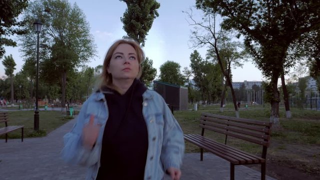 young woman jogging in the morning city park