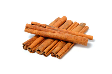 Cinnamon Sticks Stacked isolated on White background closeup macro shot