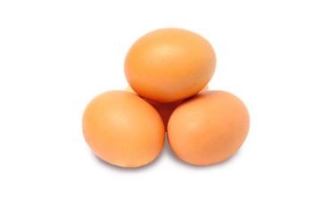 Four brown chicken eggs isolated on a white background