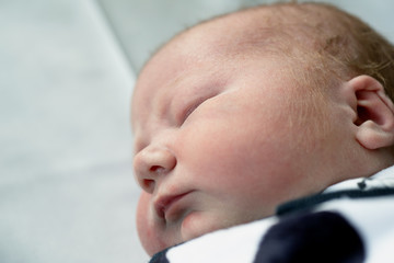 Beautiful sleeping baby boy just one day old