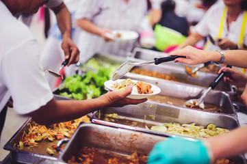 The concept of feeding : The hands of the poor receive food from the hands of the humane