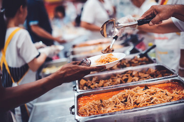 Feeding to the poor to hands of a beggar : concept of feeding food for beggar