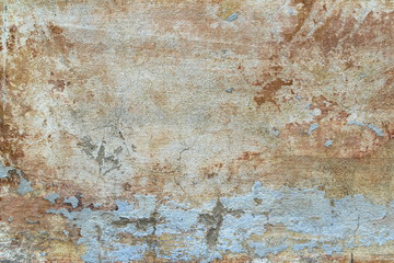 Old cracked wall covered with stucco with abstract watercolor blue, pink and ebony spots of paint. Multicolored vintage background for wallpaper, background and scrapbooking. 