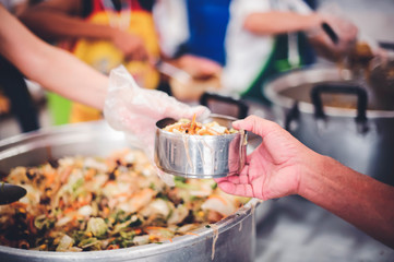 Feeding to the poor to hands of a beggar : concept of feeding food for beggar