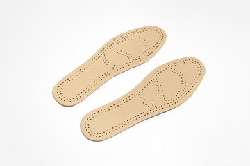 Leather insoles for shoes isolated on white background.High-resolution photo.Perspective view.