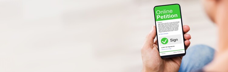Man's Hand Holding Cell Phone With Blank Screen