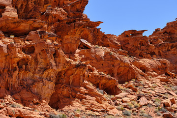 Arches and plateaus carved into the Red Aztec Sandstone in the Nevada Desert