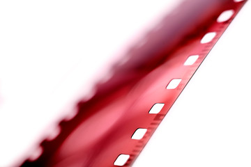 Color negative film in blur. 35mm negative film. Photographic film view with shallow depth of field.
