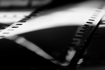 Black and white negative film with reflecteions in blur. 35mm negative film. Photographic film view...
