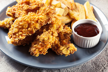 Chicken strips in cornflakes breadcrumb