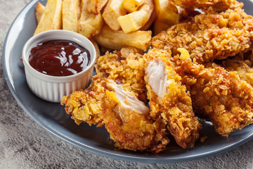 Chicken strips in cornflakes breadcrumb