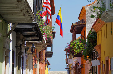 Walking the narrow and colorful streets with historic old buildings with wooden balconies and urban...