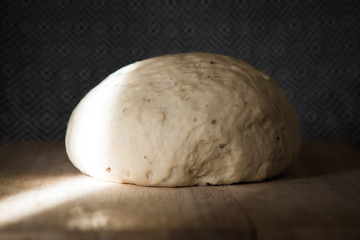 bread dough on wooden table