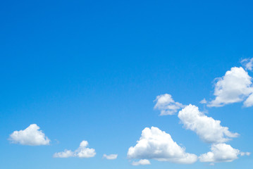 Group of fluffy cloud with clear blue sky background and copy space for adding some text