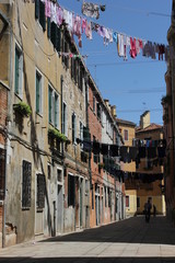 Ancient road in Venice with cloths hang out to dry