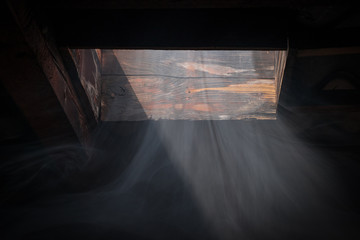 Visible flow of air through the attic window