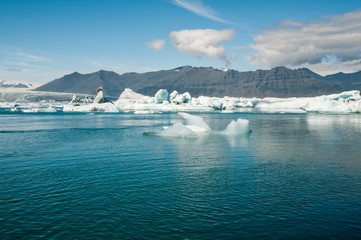 scenic view over lagoon with iceberg
