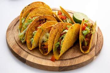 baked oven beef taco with tomato, lemon and lettuce