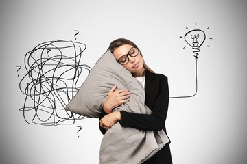 Sleeping woman with pillow and her bright idea