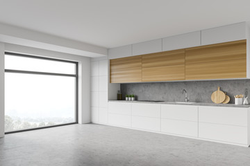 White kitchen corner with wooden cupboards