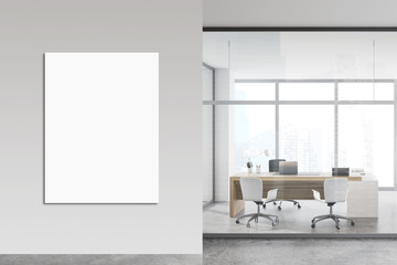 White and glass CEO office with poster