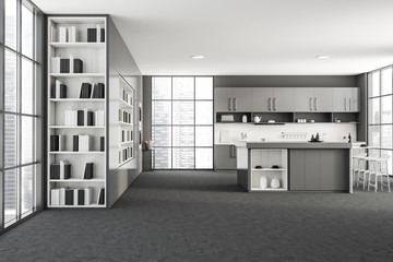 Gray kitchen interior with bar and bookcase