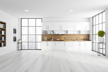 White kitchen with countertops and bookcase