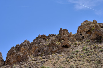 Fototapeta na wymiar Rock outcrop with natural caves