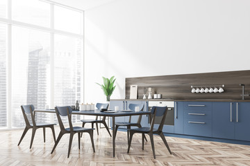 White kitchen corner, blue countertops and table
