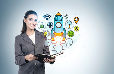 Cheerful businesswoman with planner startup sketch