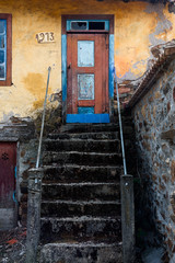 traditional house of Montesinho.
entrance of a traditional house with an old stairway in a rural village in Montesinho Braganca, Portugal - 352125042