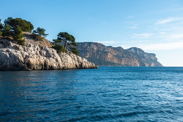 Naklejka premium The beautiful coast of the Calanques National Park with Cap Canaille in the background, the highest sea cliff of France located near Cassis.