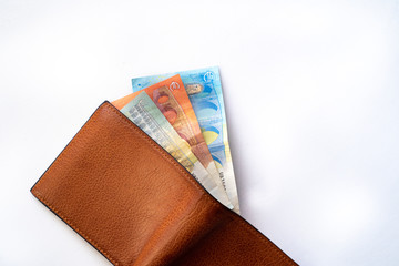 European Banknotes in a open wallet. Wallet with money on a white background.