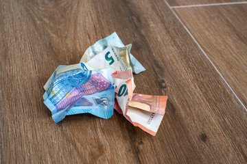 Crumpled euro money on a wooden background. Crumpled Banknotes.