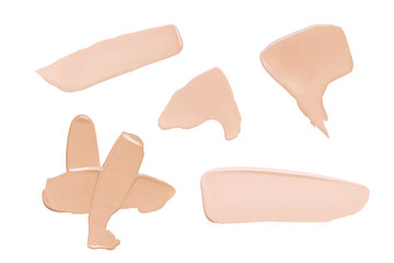 Face foundation Brush strokes set isolated on white. Natural colors cosmetic products smeared spots swatches