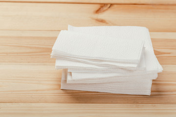 white paper napkin with a textured pattern on an old table