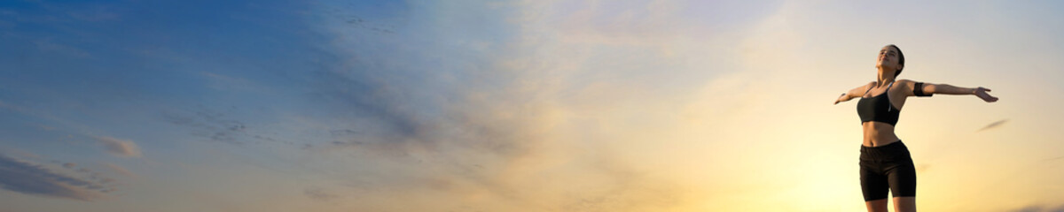 A young slim athletic girl in sportswear with snakeskin prints performs a set of exercises. Fitness and healthy lifestyle.