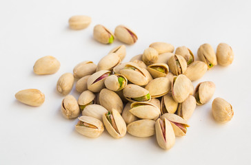 roasted pistachios on white background