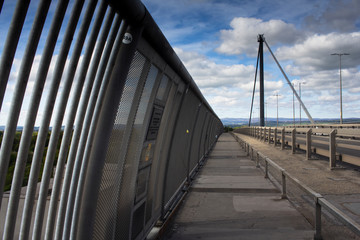 The walkway on the Eskine Bridge over the river Clyde in Scotland on a spring morning.