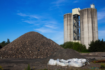 Industrial landscape with silos and aggregates in Scotland on a sunny spring day