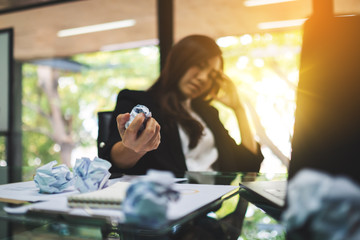Businesswoman get stressed , screwed up papers while having a problem at work in office