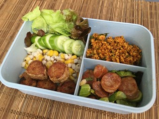 This lunch set includes Stir Fried Pork, Chinese Sausage Salad, Deep Fried Crab Meat Rolls and corn mixed millet.