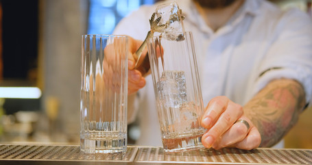 Male Bartender work in the pub