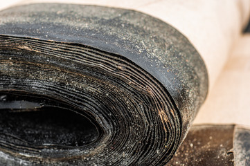 Rolls of building roofing material for waterproofing and roofing layers closeup.