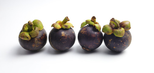 Four mangosteen on a white background