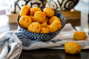 Cheese Bread served in a restaurant. 

Brazilian snack cheese bread - Traditional Brazilian food.